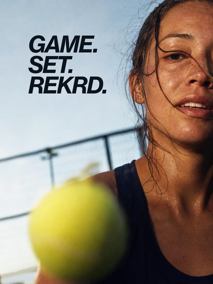 Tennis player mid-rally under the headline Game. Set. REKRD.