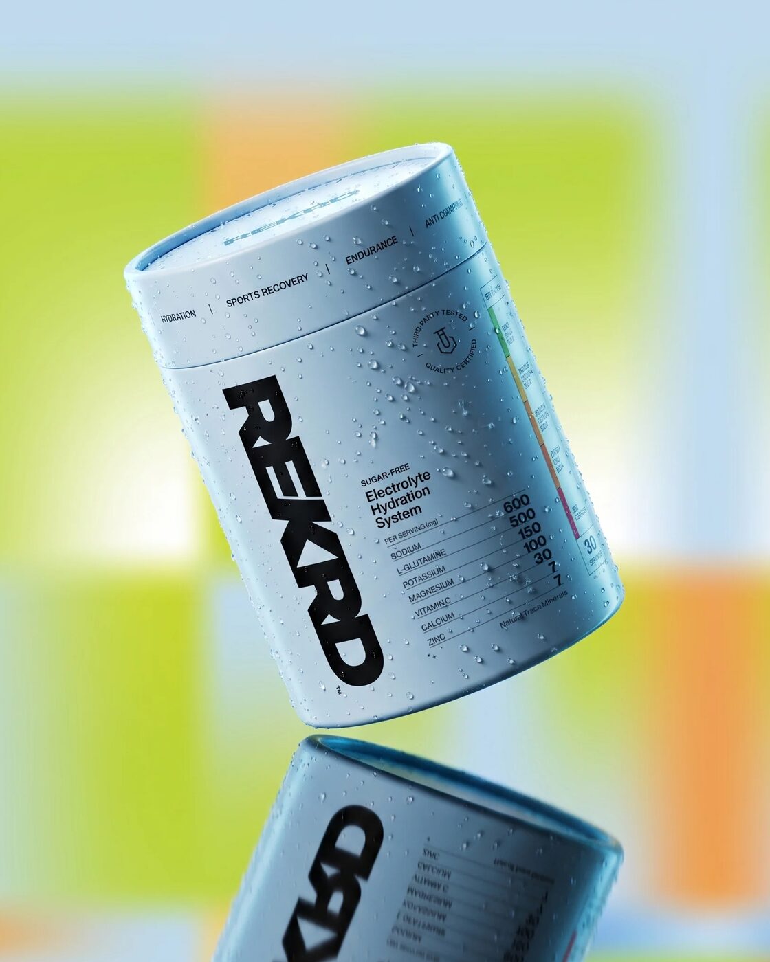The REKRD powder-blue 30-sachet tube, beaded with water, reflected on a glossy surface