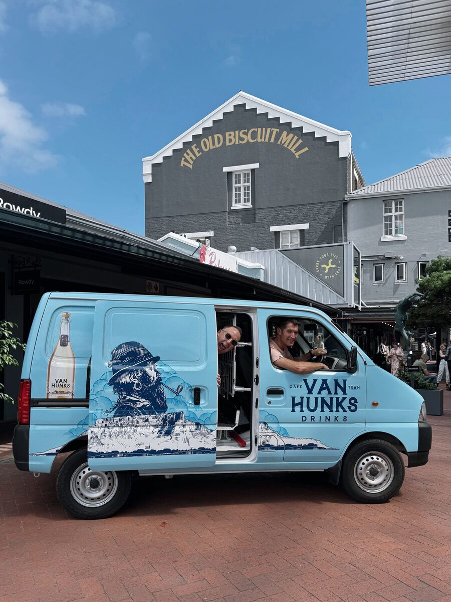 The Van Hunks delivery van, painted with the brand's woodcut character, outside the Old Biscuit Mill in Cape Town